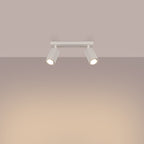 Plafonnier Karbon 2 spots barre beige allumé, deux faisceaux orientés