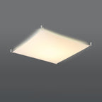 Plafonnier Luna 4 allumé, lumière blanc chaud diffusée par la toile de tissu
