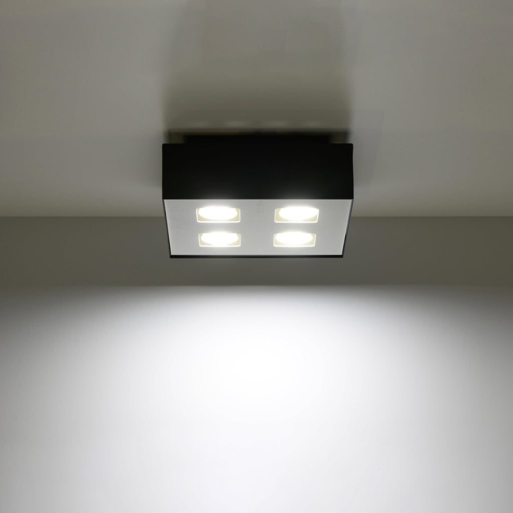 Plafonnier Mono 4 acier noir avec ses quatre spots allumés