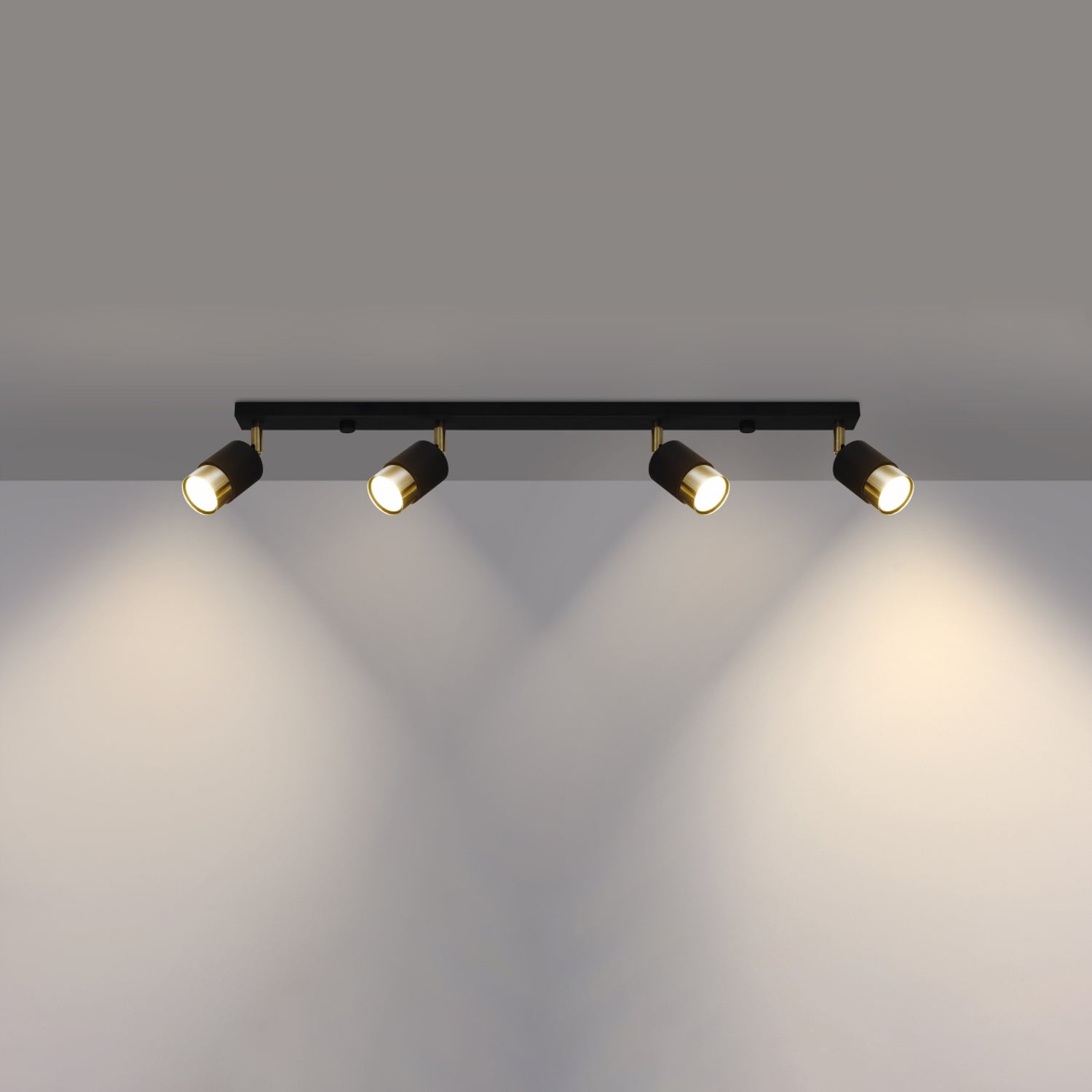 Plafonnier Nero 4 acier noir et doré allumé, quatre faisceaux orientables
