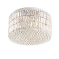 Plafonnier Puccini tambour de prismes de verre sur trois rangs et nappe de perles à facettes sur structure chromée