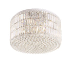 Plafonnier Puccini tambour de prismes de verre sur trois rangs et nappe de perles à facettes sur structure chromée
