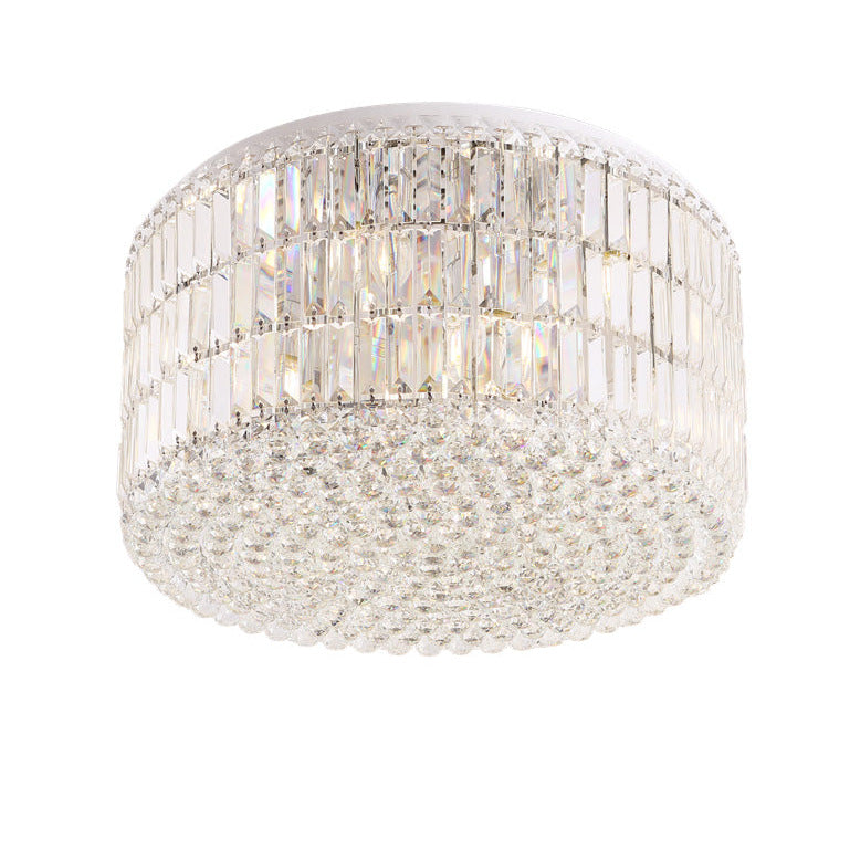 Plafonnier Puccini tambour de prismes de verre sur trois rangs et nappe de perles à facettes sur structure chromée