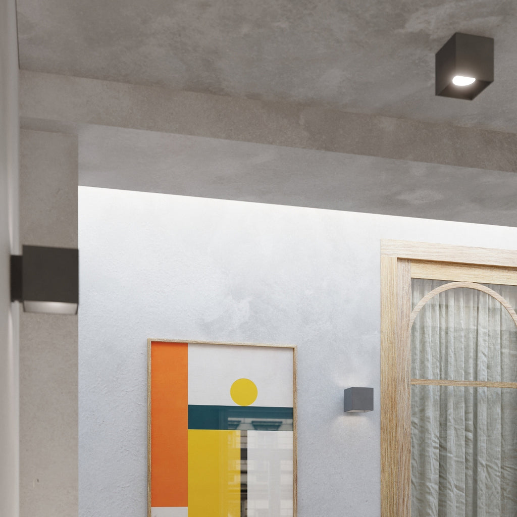 Plafonnier Quad 1 anthracite monté au plafond d'un intérieur