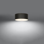 Plafonnier Skala 30 en tissu noir allumé, lumière diffusée par le verre vers le bas