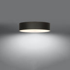 Plafonnier Skala 50 en tissu noir allumé, lumière diffusée par le verre vers le bas