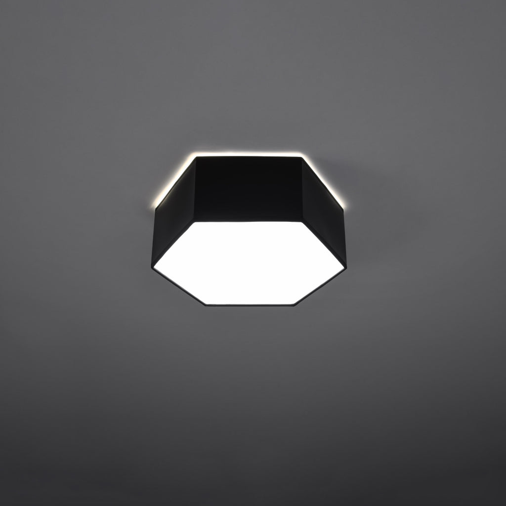 Plafonnier Sunde 11 noir allumé, lumière diffuse vers le bas et halo au plafond