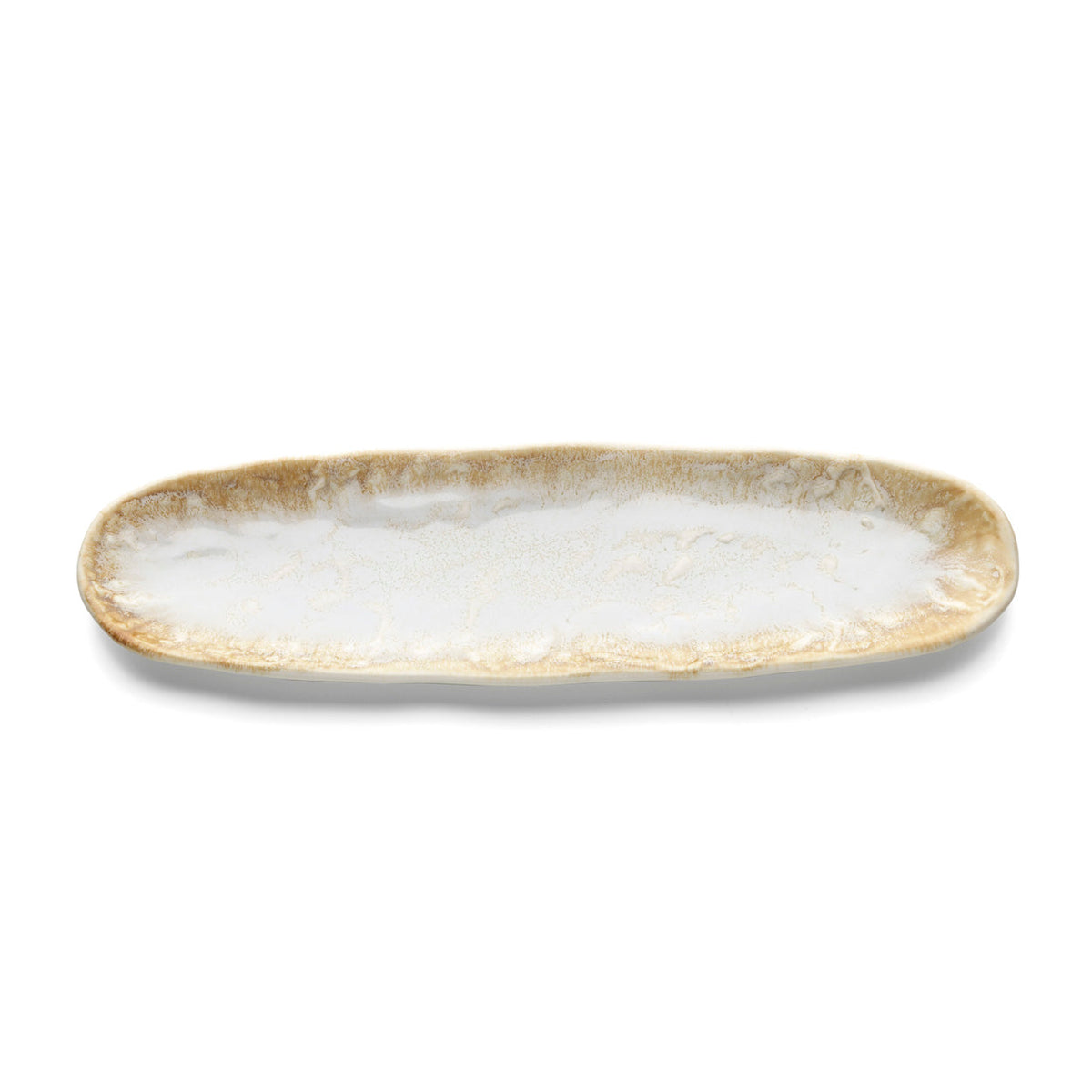 Vue de dessus du plat ovale avec son centre blanc et sa couronne miel granuleuse