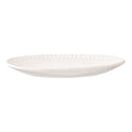Plateau ovale céramique blanche relief rayonnant 30x20 cm vue de profil