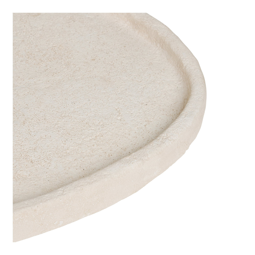 Gros plan texture granuleuse ciment beige rebord arrondi plateau décoratif