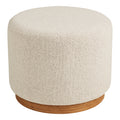 Pouf rond Daisy en bouclé sable vu de face sur son socle en bois