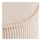 Pouf Taupo velours côtelé beige détail liseré pompons couture artisanale gros plan