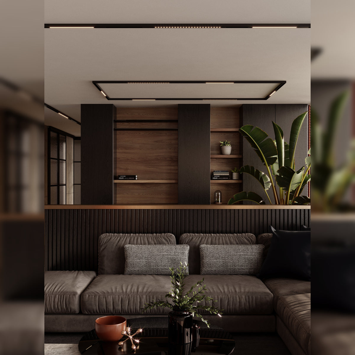 Réglettes Magnetic à grille Métal noir dans des rails aimantés noirs au plafond d'un salon au-dessus d'un canapé et d'une bibliothèque en bois
