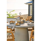 Étagère Rifbjerg herbe de mer naturelle sur une terrasse au coucher du soleil