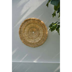 Soleil mural Sehseh en sisal 85 cm en situation