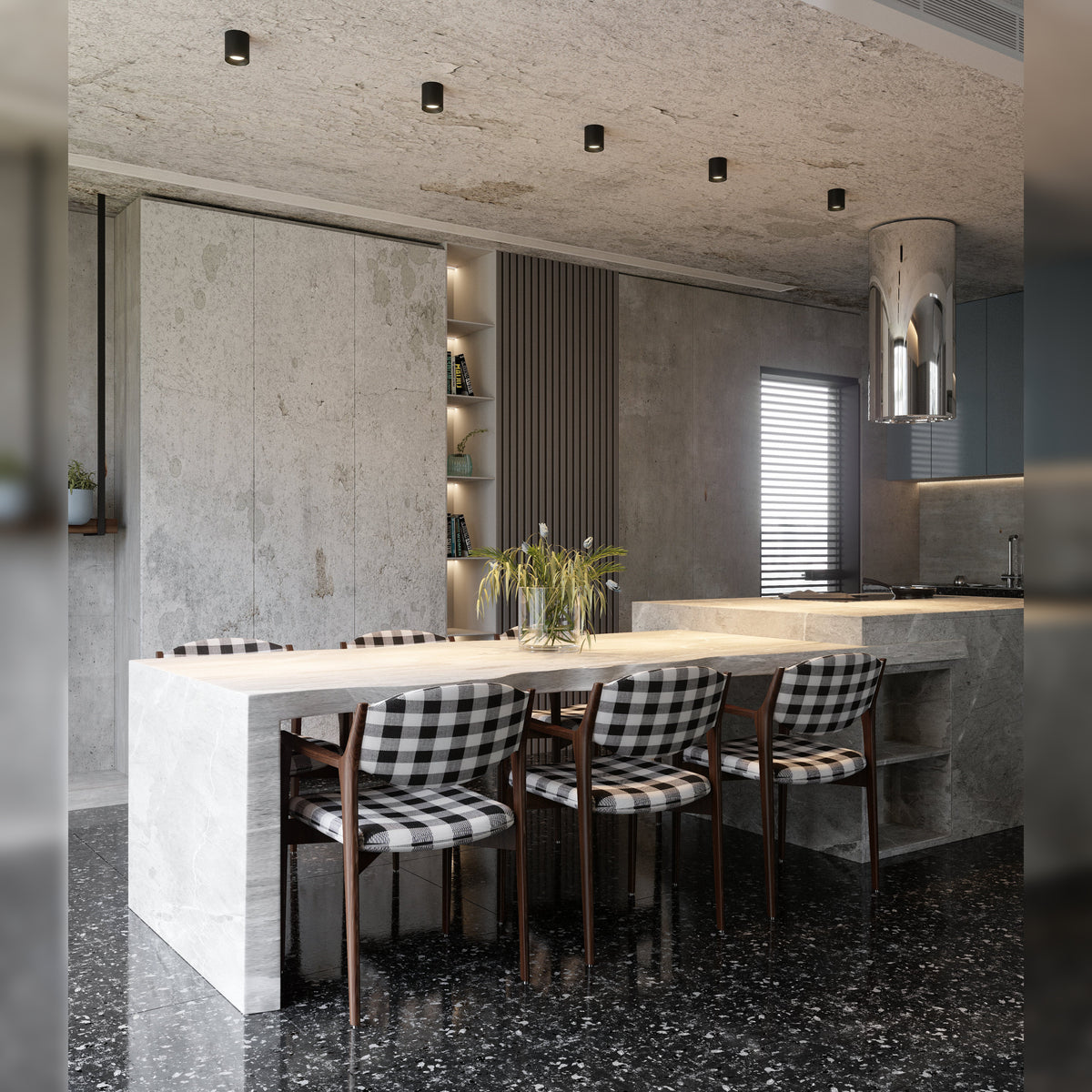 Cinq spots Chip noirs alignés sous le plafond de béton d'une cuisine ouverte