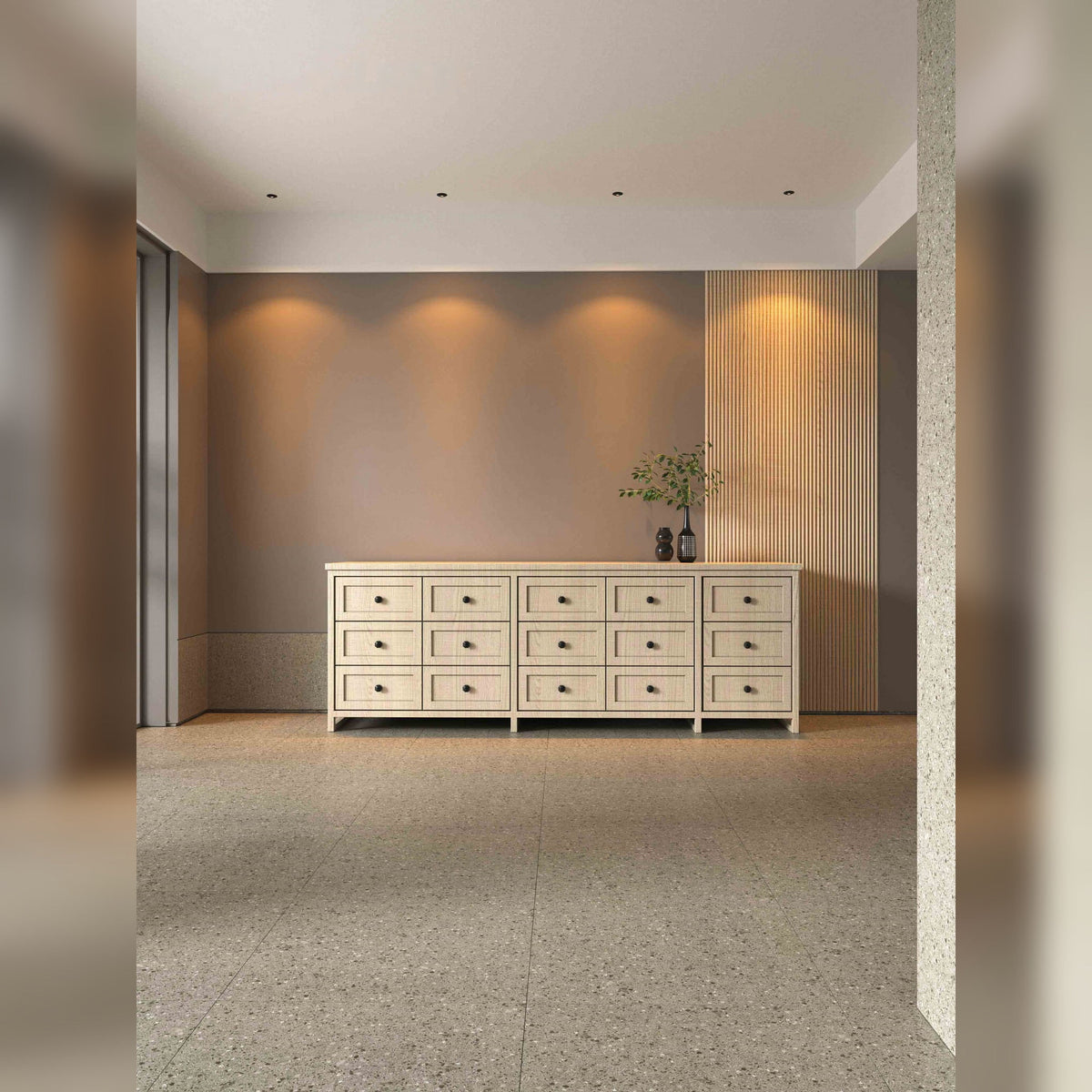 Spots encastrés Yuca noirs alignés au plafond éclairant le mur au-dessus d'une commode en bois clair
