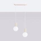 Suspension Halo 2 boules opale barre beige suspendue au-dessus d'une table