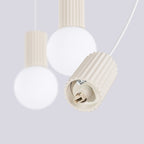 Suspension Halo 3 boules opale barre beige dans un intérieur