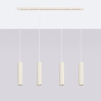 Suspension Karbon 4 tubes barre beige installée au-dessus d'une table