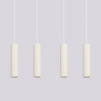 Suspension Karbon 4 tubes barre beige dans un intérieur
