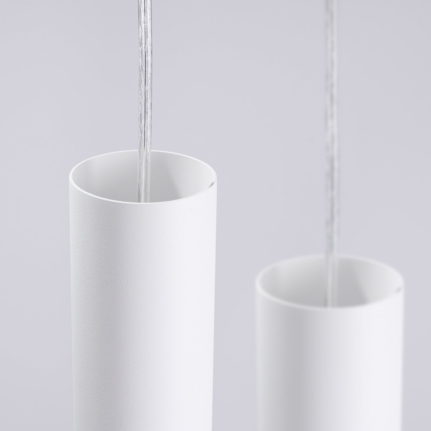 Suspension Lami 3 tubes ajourés en grappe acier blanc GU10 en ambiance