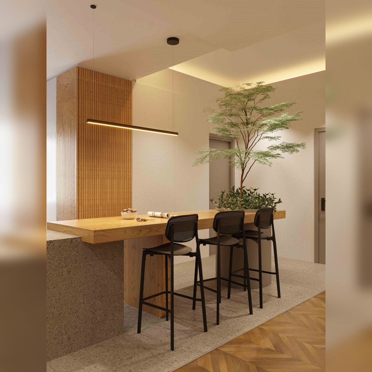 Suspension Trio I noire allumée au-dessus d'une table haute en bois bordée de trois tabourets noirs