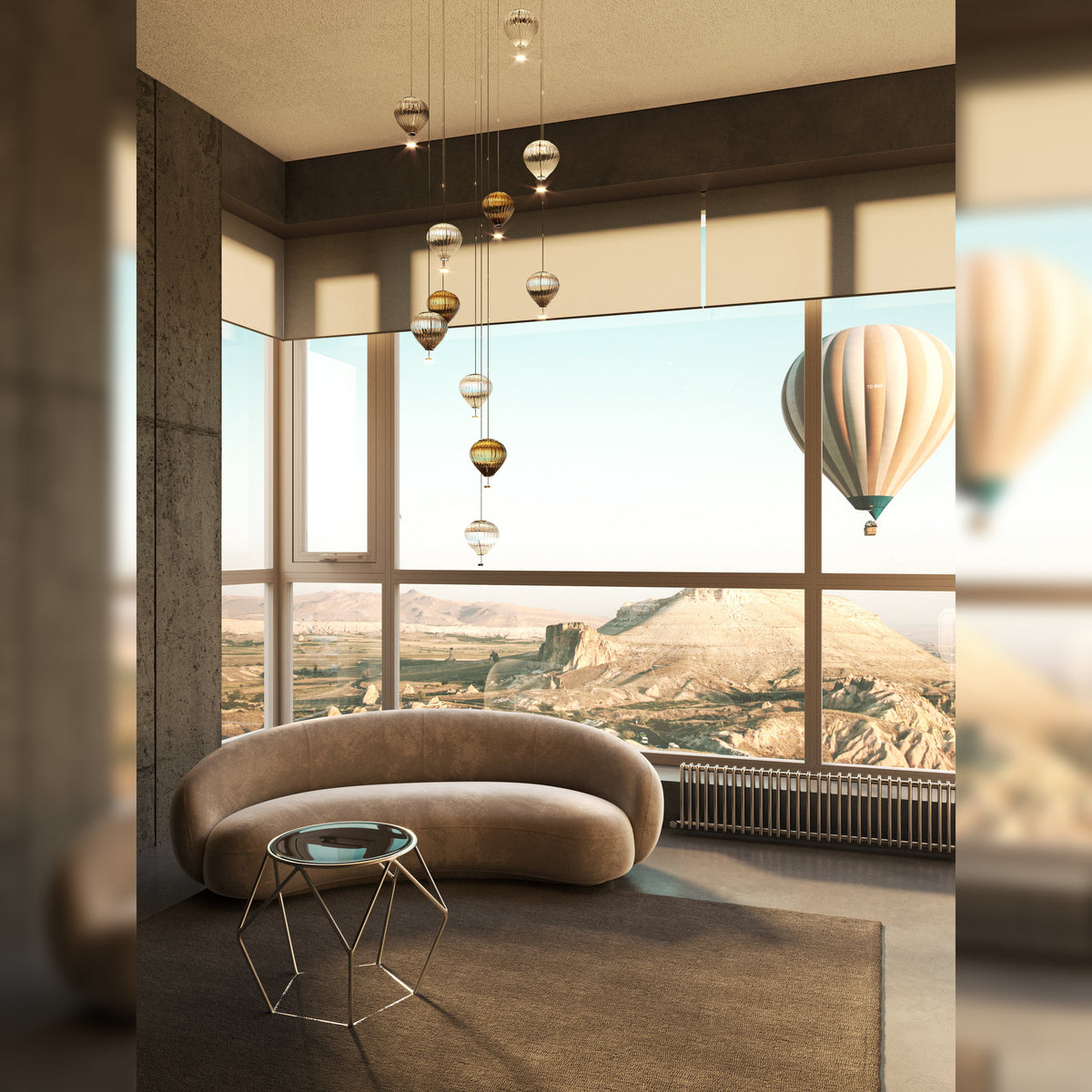 Suspension Palloncini 11 en cascade dans un salon avec canapé courbe devant une baie vitrée et une montgolfière
