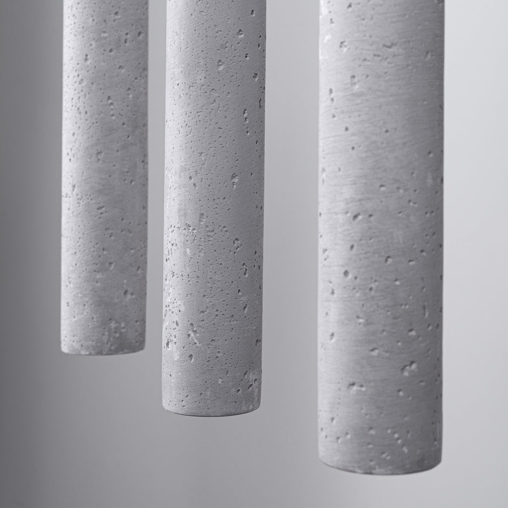 Suspension Pastelo 3 en ligne tubes fins béton gris G9, détail du béton gris brut