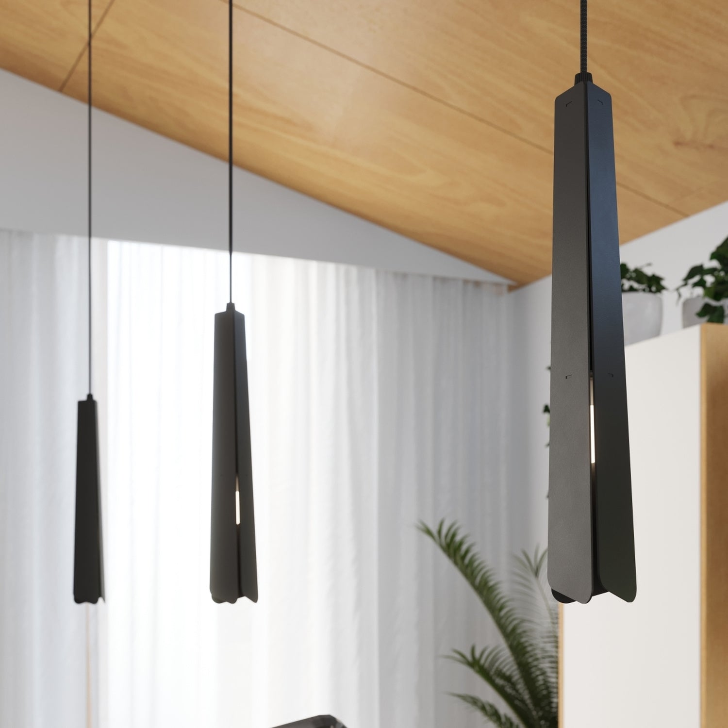 Suspension Prysm 3 en grappe métal noir G9 en situation dans un intérieur