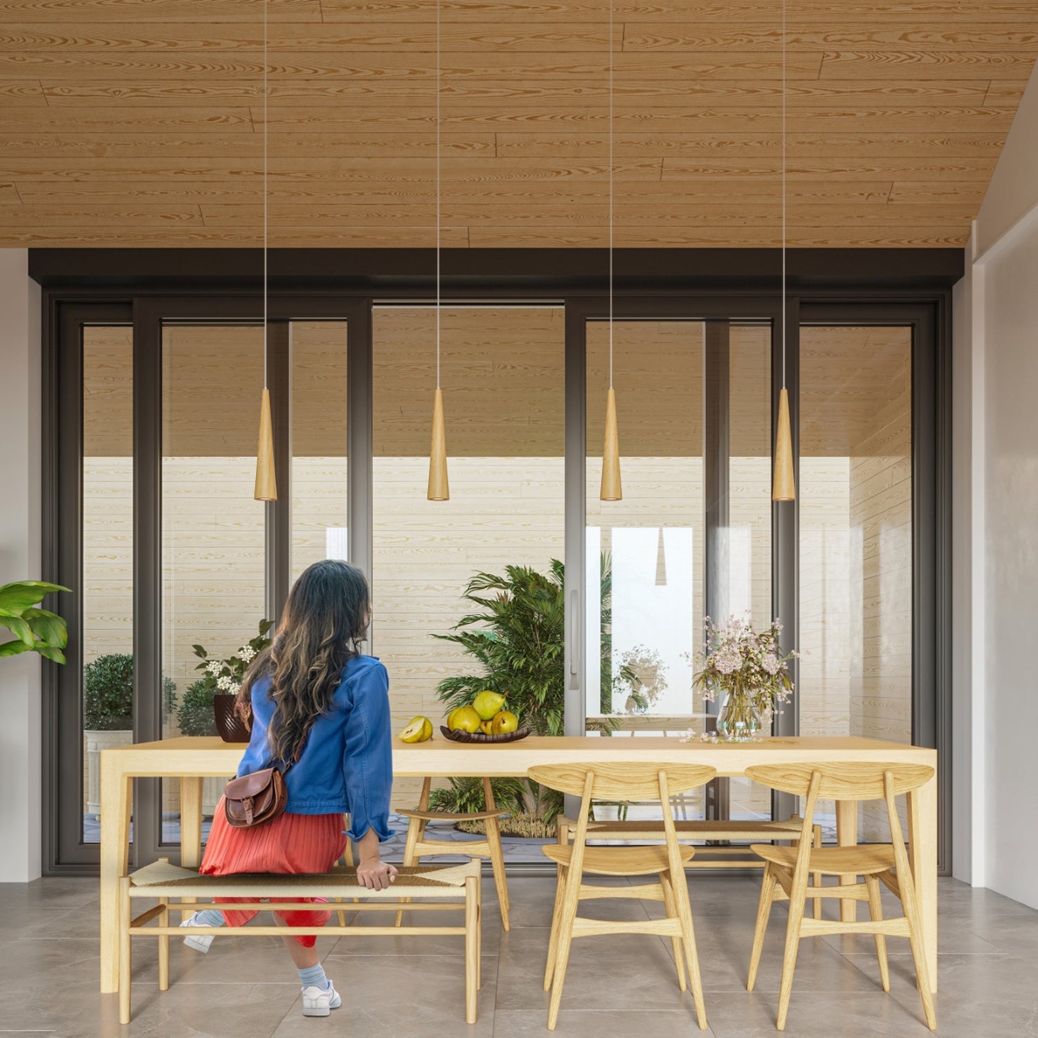Suspension Sula 3 en grappe bois naturel au-dessus d'une table