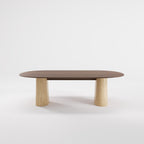 Table à manger Anchor 240 cm en noyer foncé vue de face sur ses deux socles en travertin
