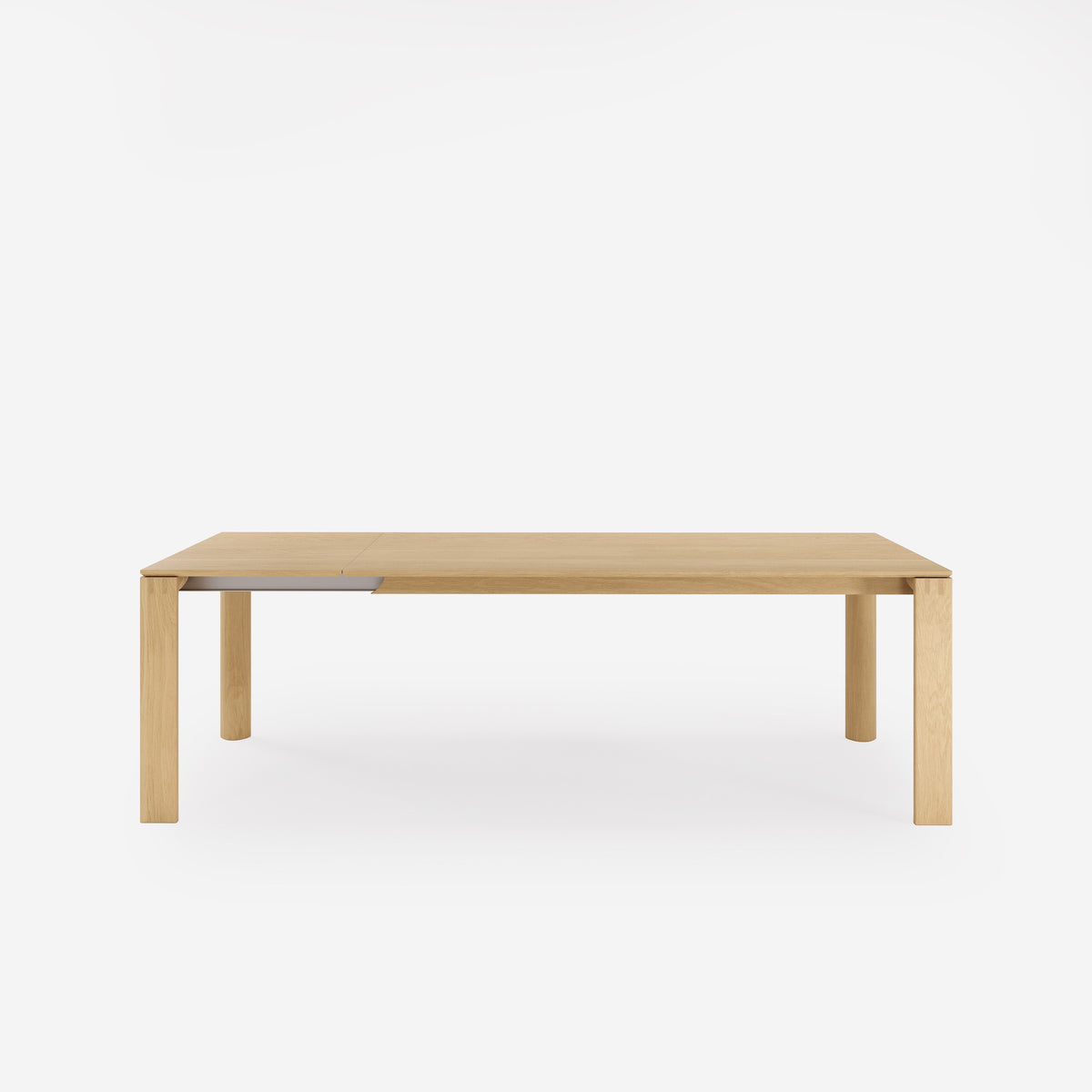 Table à manger Nuria en chêne naturel avec une allonge déployée vue de face