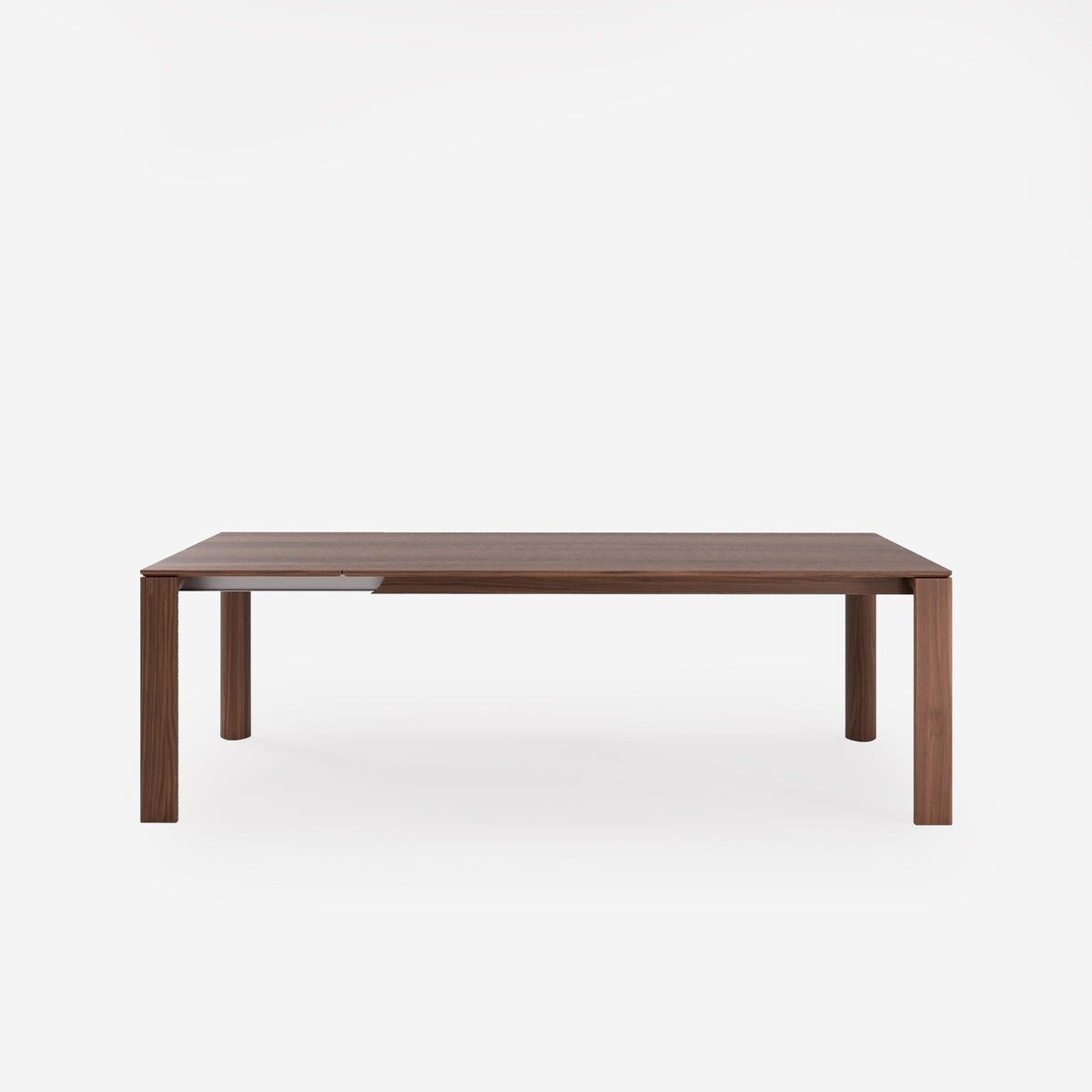 Table à manger Nuria en noyer foncé avec une allonge déployée vue de face