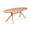 Table à manger ovale Kulala en teck recyclé vue de trois quarts avec son piètement à jambes obliques sur fond blanc
