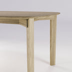 Jonction de la ceinture et d'un pied de la table Soma en chêne naturel