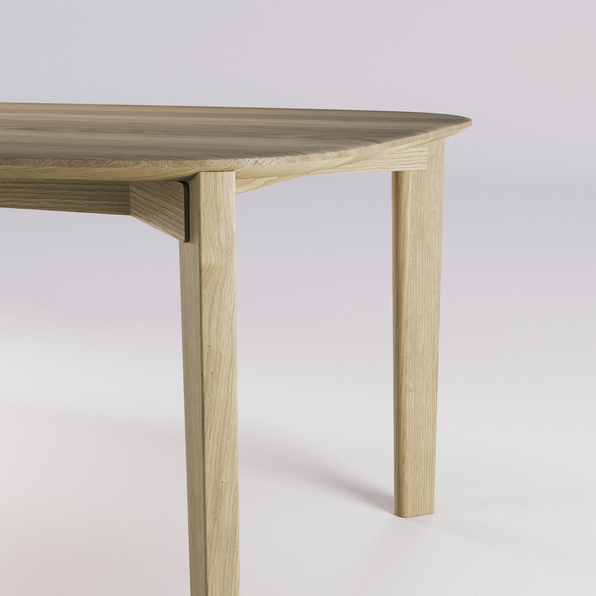 Jonction de la ceinture et d'un pied de la table Soma en chêne naturel