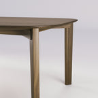 Jonction de la ceinture et d'un pied de la table Soma en noyer foncé