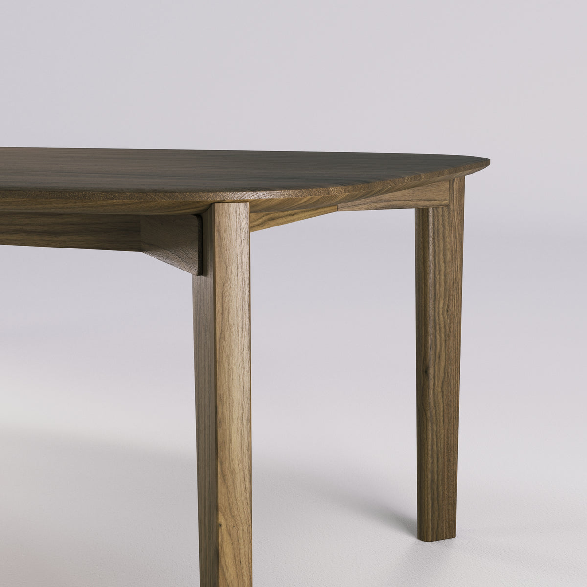 Jonction de la ceinture et d'un pied de la table Soma en noyer foncé