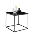 Table Vita noire vue trois quarts avec bougeoirs blancs et noirs fond blanc
