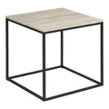 Table d'appoint Vita plateau travertin beige structure cube acier noir vue trois quarts