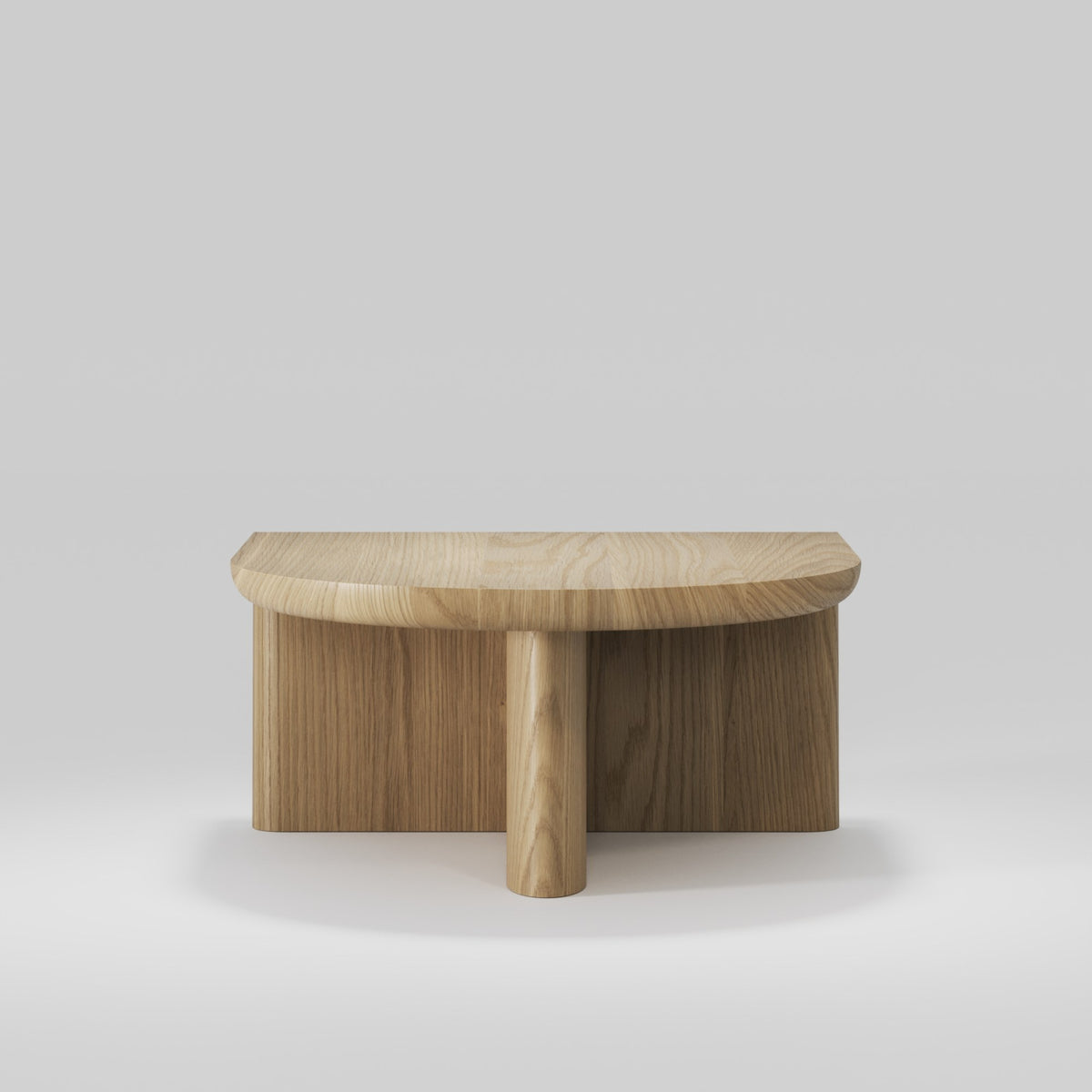 Côté arrondi de la table basse Re-Form en chêne naturel et ses voiles croisés