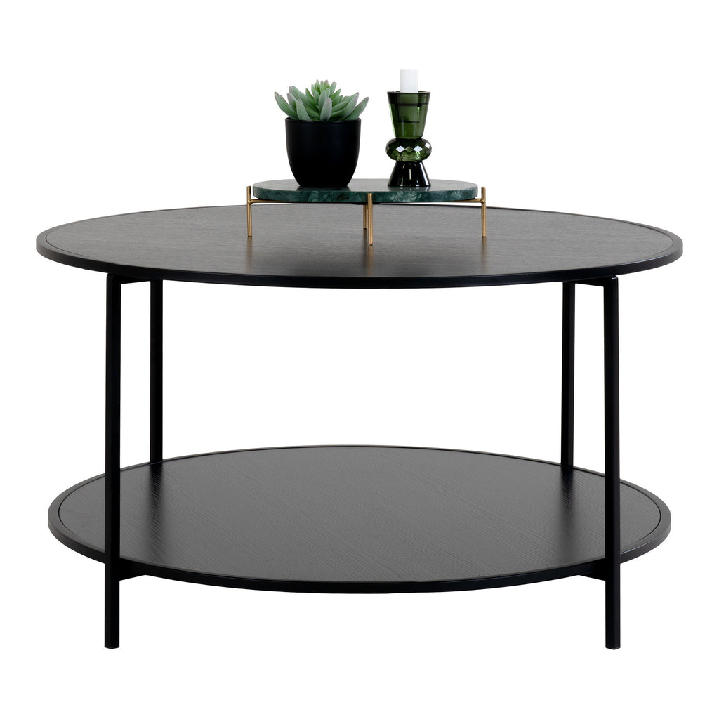 Table basse Vita ronde noire plateau supérieur avec décoration vue légèrement plongeante