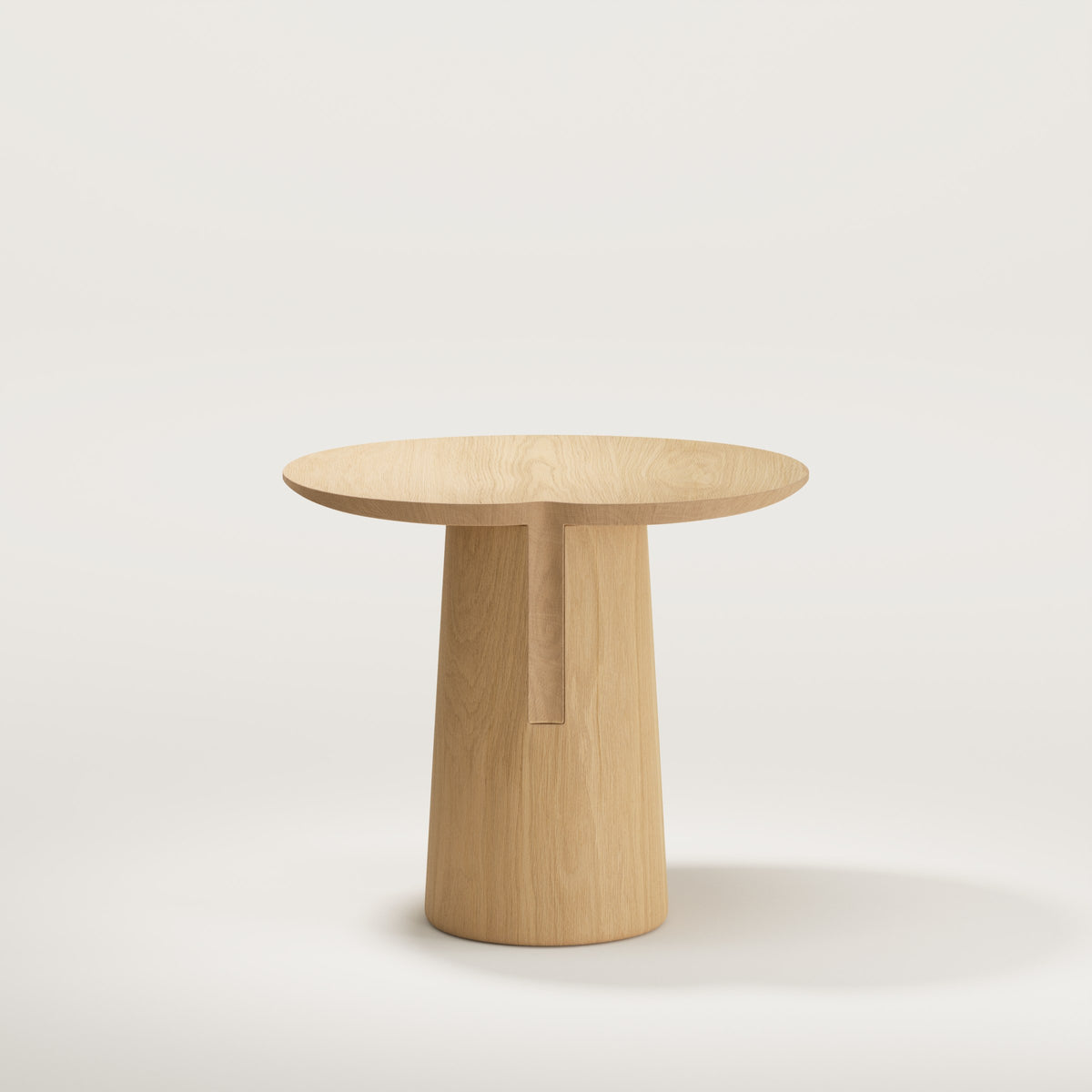 Dos de la table d'appoint Anchor en chêne montrant le tenon engagé dans le socle