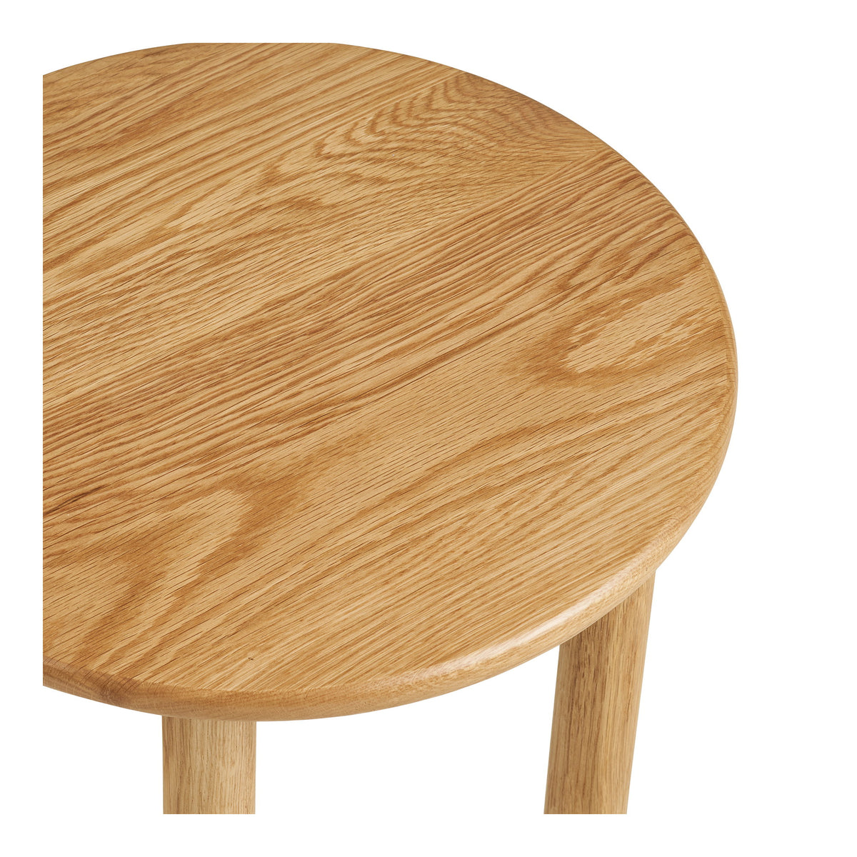 Détail du plateau rond en chêne massif de la table Jena et de son bord arrondi