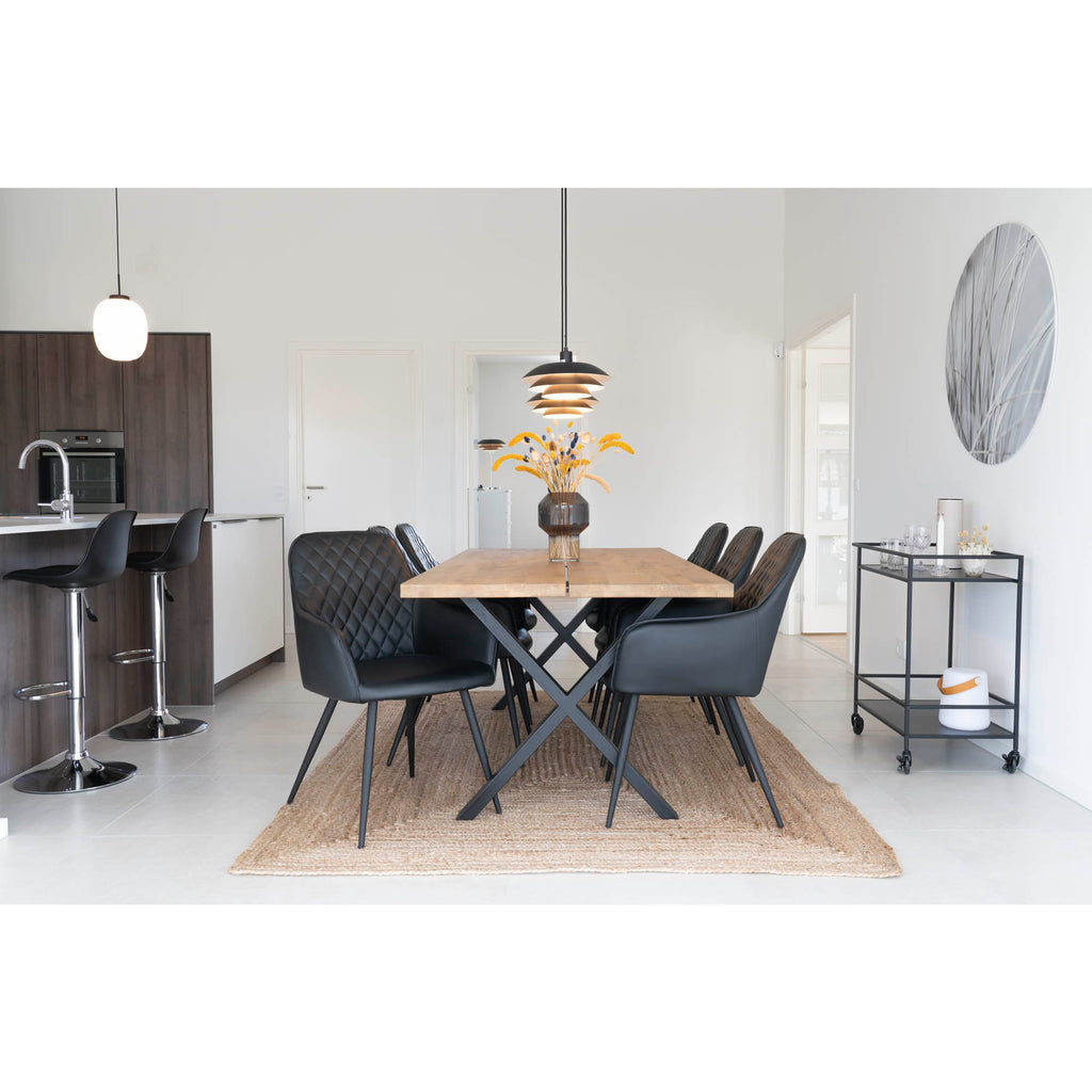Tapis Bombay jute naturel salle à manger table bois chaises cuir noir sol blanc
