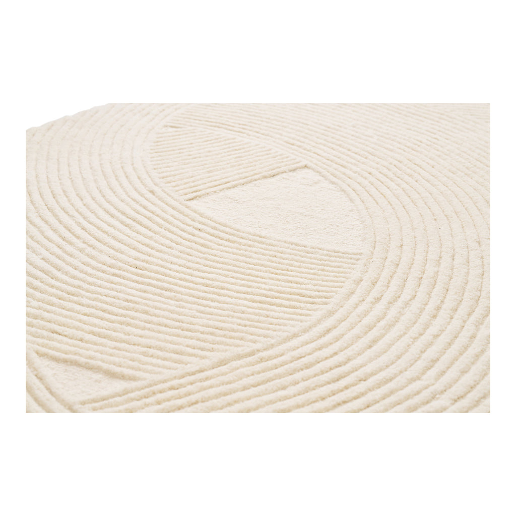 Tapis Pune laine ivoire détail motif relief arcs concentriques touffetage main