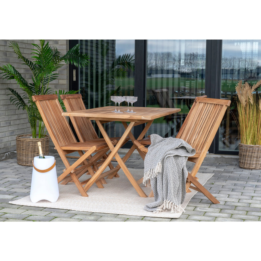 Tapis Menorca sable extérieur terrasse table teck chaises pliantes jardin