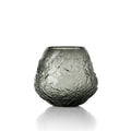 Vase Earth Crater en verre fumé gris vu de face avec sa paroi creusée de cratères