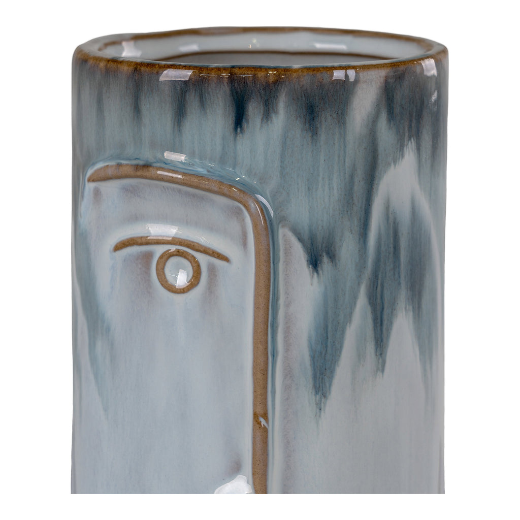 Détail œil et nez en relief brun doré vase porcelaine bleu biton émaillé réactif